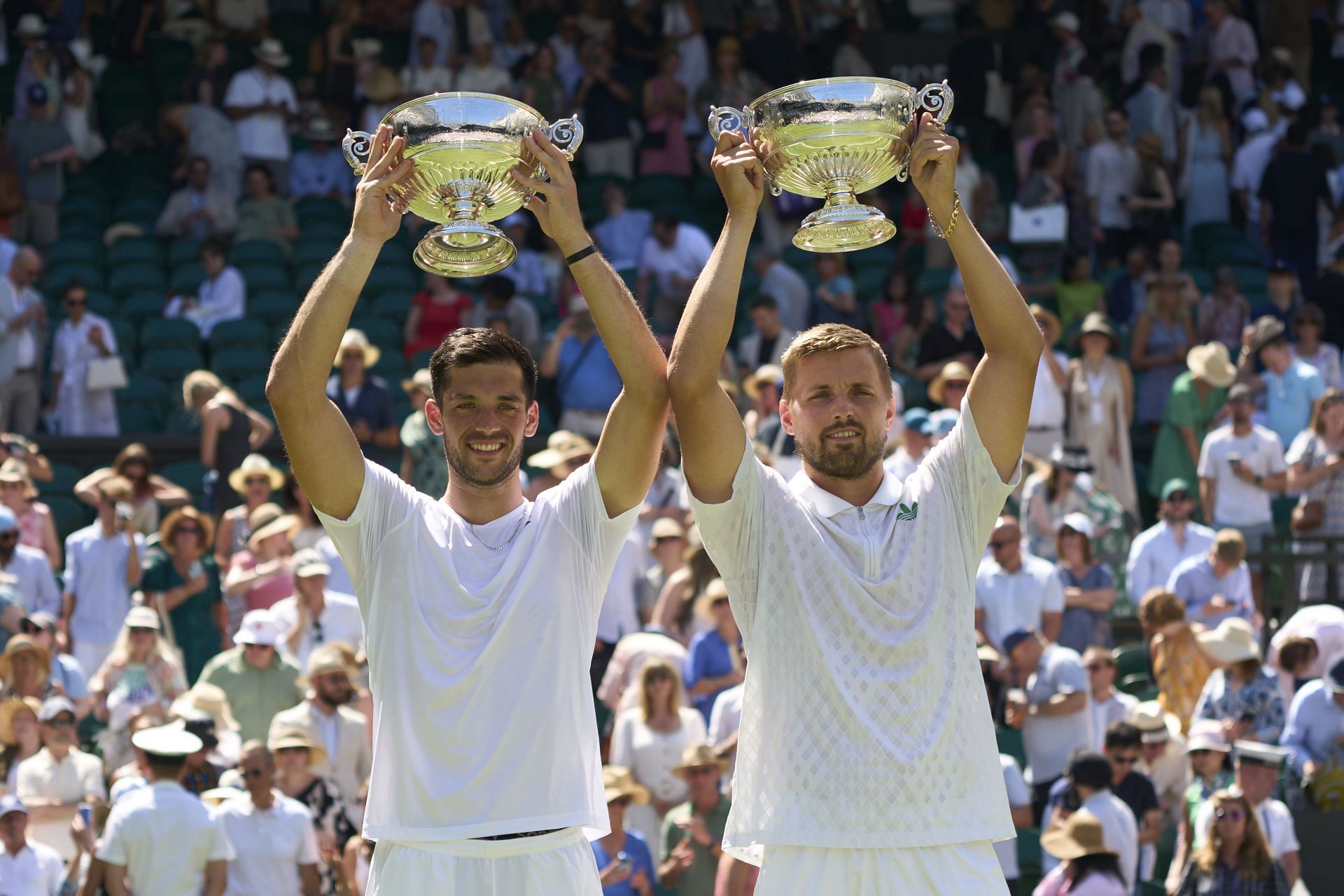 Julian Cash and Lloyd Glasspool pictured with the Wimbledon 2025 men's doubles trophy | Image Source: Getty